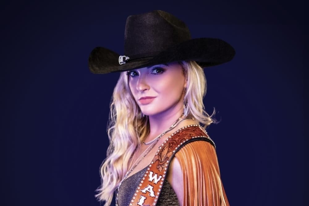 female musician in cowboy hat