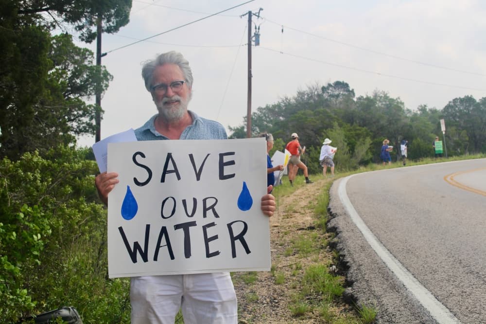 Residents, environmental groups protest development near Hamilton Pool outside UT event