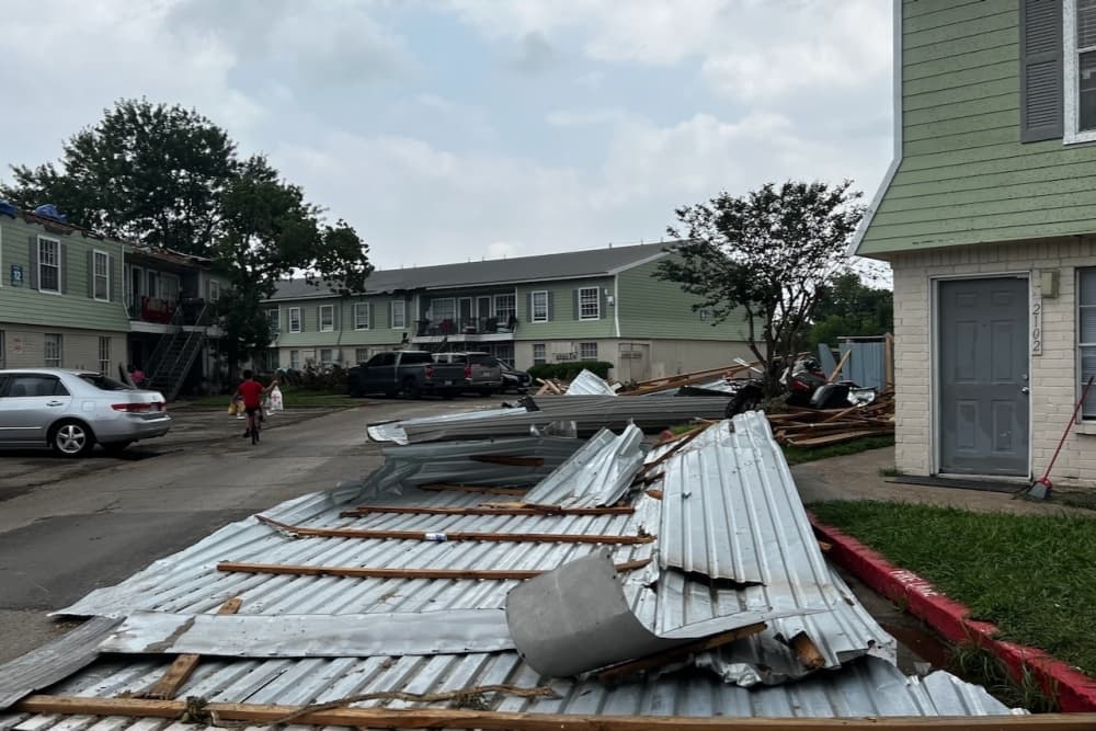Pieces of a damaged apartment complex in northwest Houston