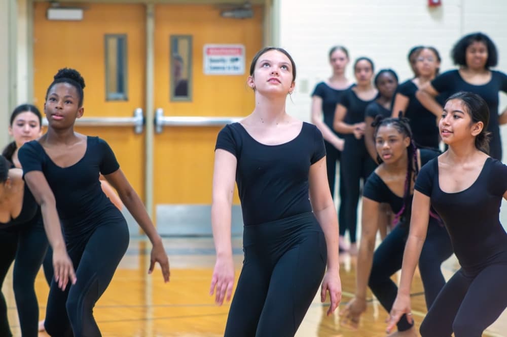 Sadler Means Young Women’s Leadership Academy students perform a dance to celebrate the start of construction on the school May 21. (Elle Bent/Community Impact)