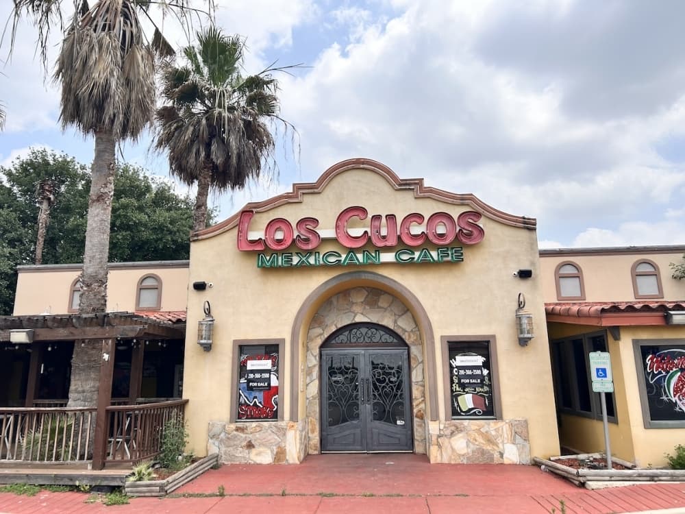 Image shows front of Los Cucos Mexican Cafe building.
