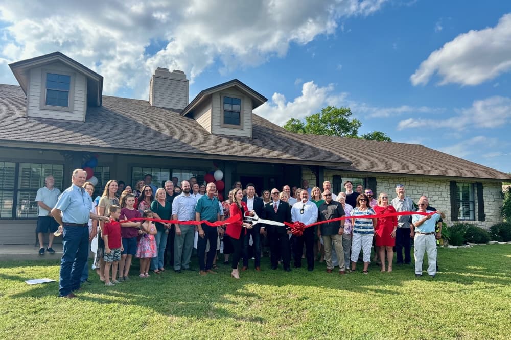 State Rep. Caroline Harris Davila, her team of staff and community members celebrated the opening of her district office in Round Rock May 29. (Brooke Sjoberg/Community Impact)