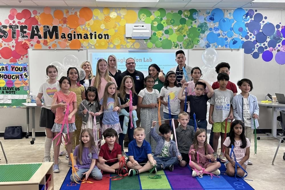 Students, staff, LEF members and district officials pose in lab