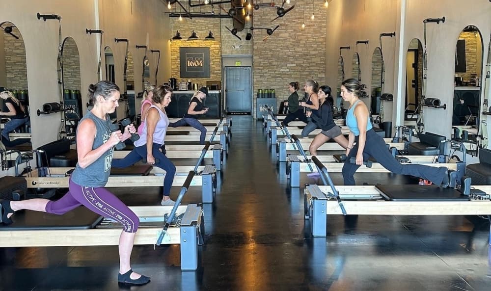 Image shows a Pilates class.