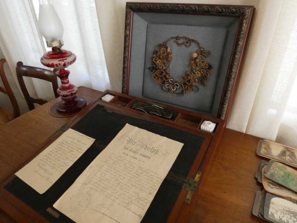 Image shows a hair wreath made to show respect for a deceased person.