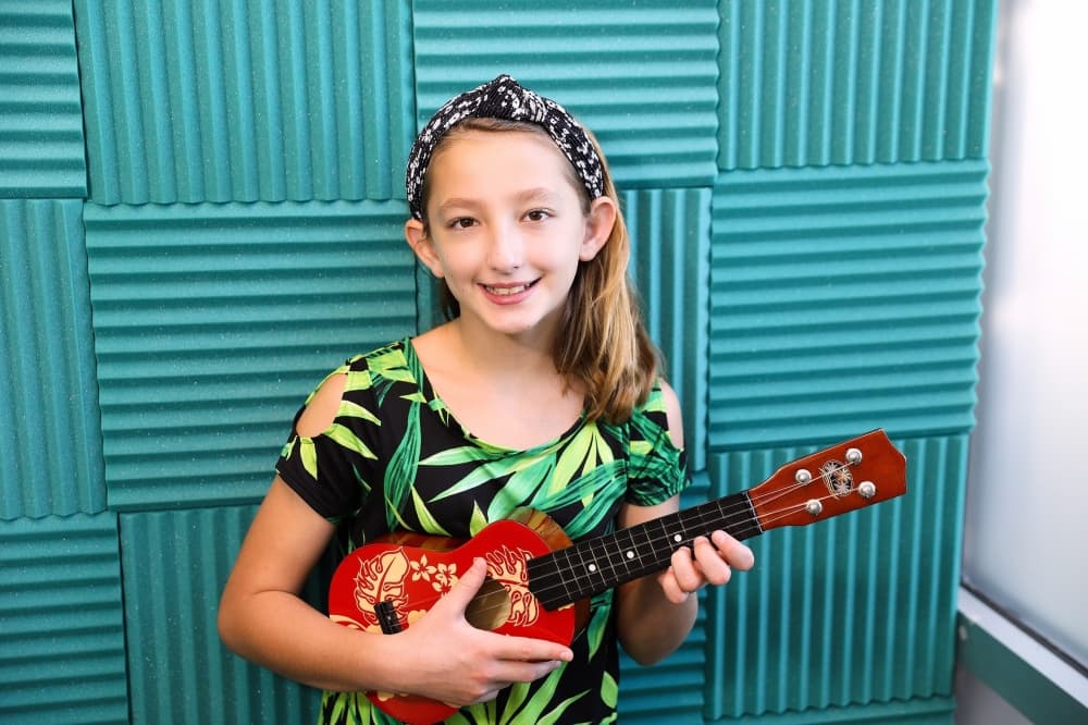 girl plays the Ukulele