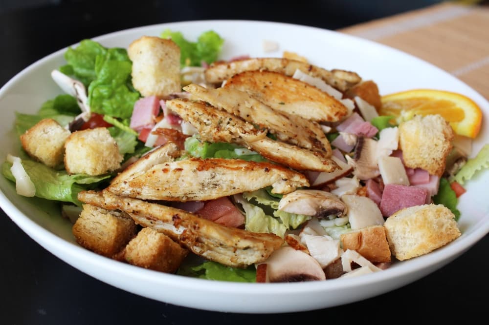 Salad with chicken on top. 