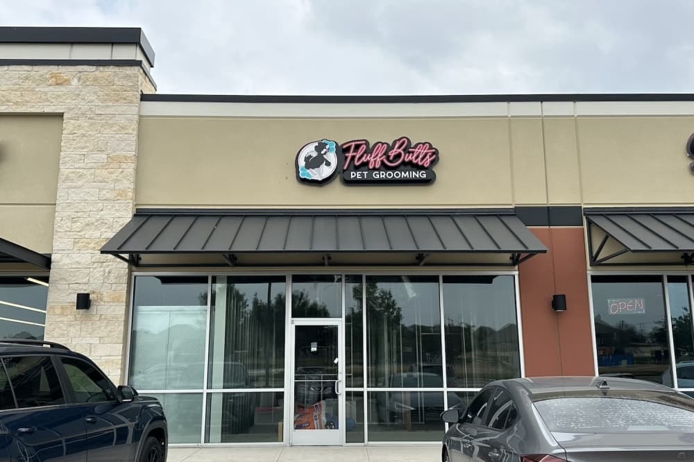 Image shows exterior shot of FluffButts Pet Grooming.