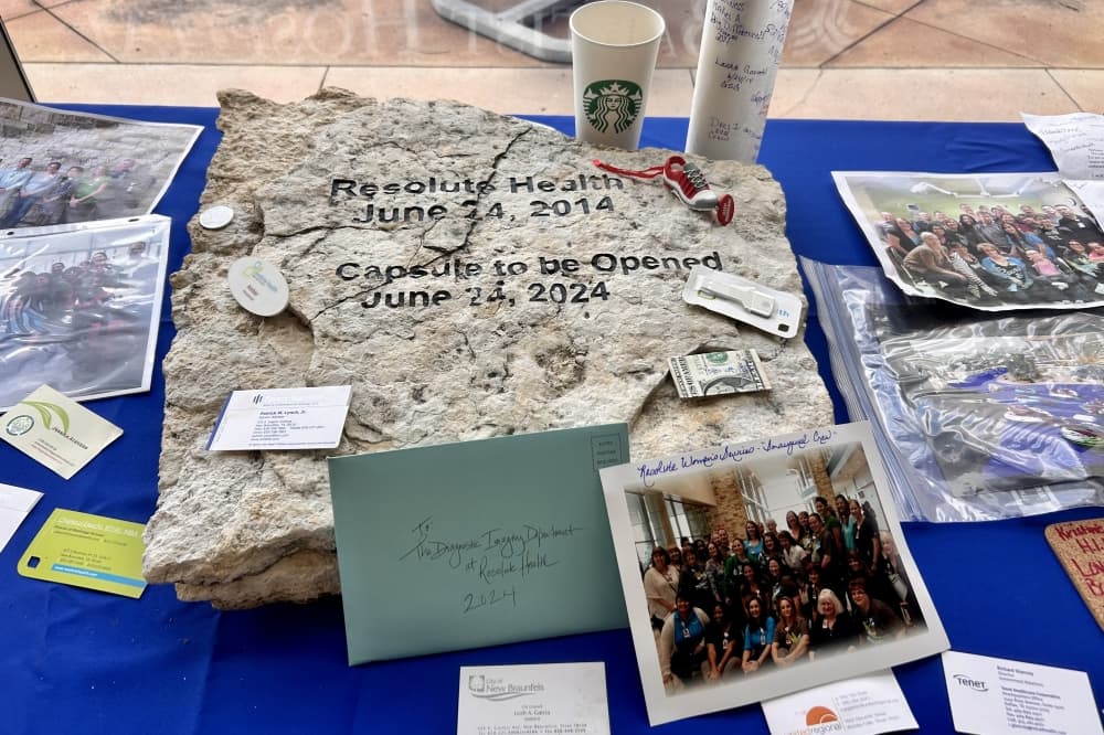 Items from the time capsule. (Shaheryar Khan/Community Impact)