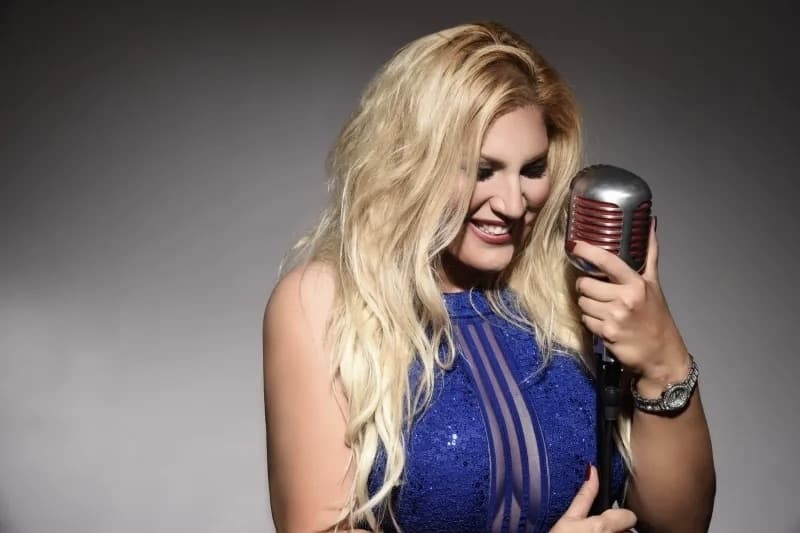 blonde woman with microphone
