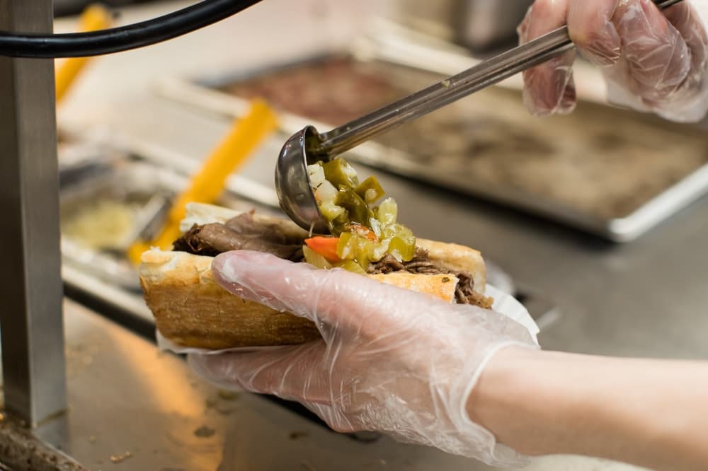 The concept’s menu consists of Chicago-style hot dogs, Italian beef and sausage sandwiches, chicken sandwiches, burgers, fries, salads, pasta plates, milkshakes and chocolate cake. (Courtesy Portillo's)