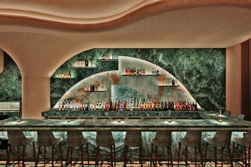 An image of a bar as various drinks are placed on the wall. 