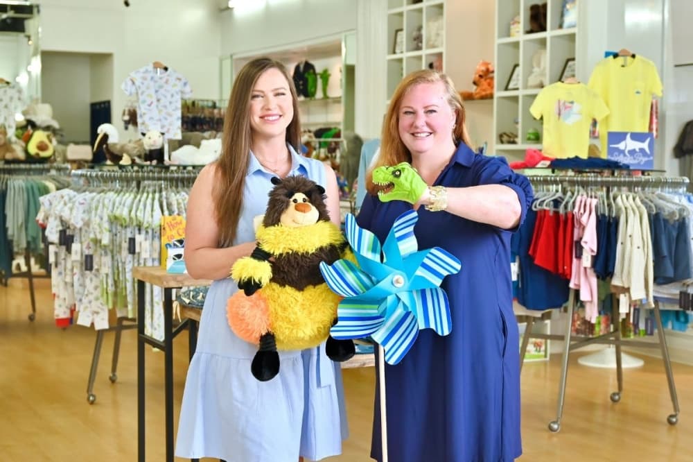 mother and daughter show items from story