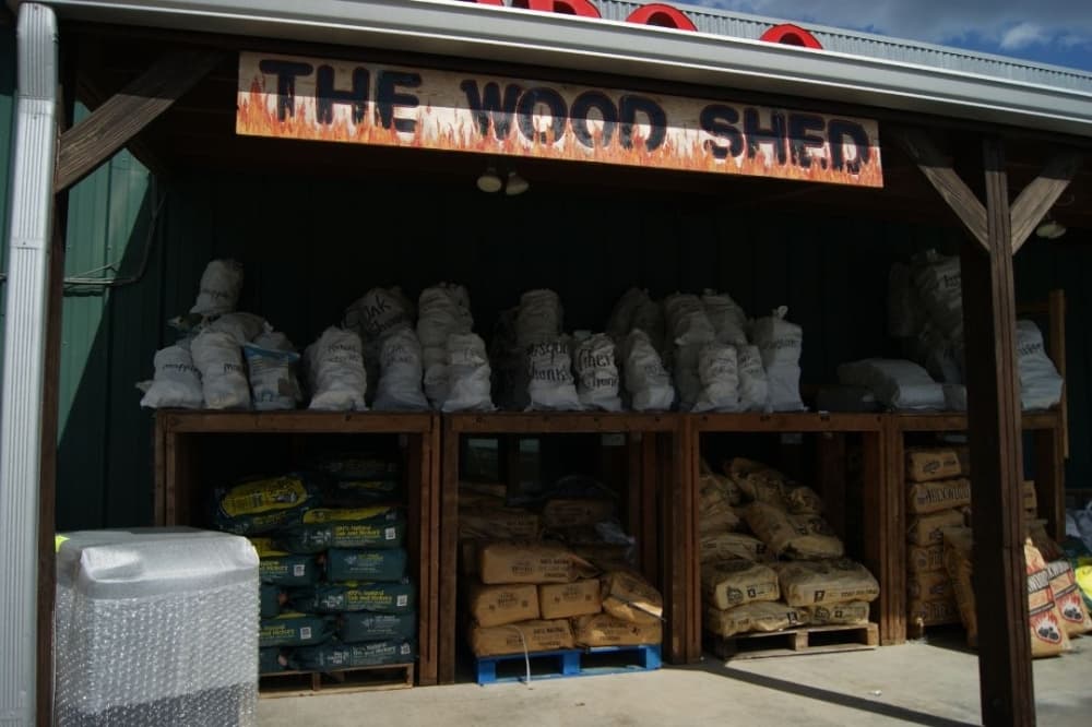 Image of wood pellets outside the front of the store. 