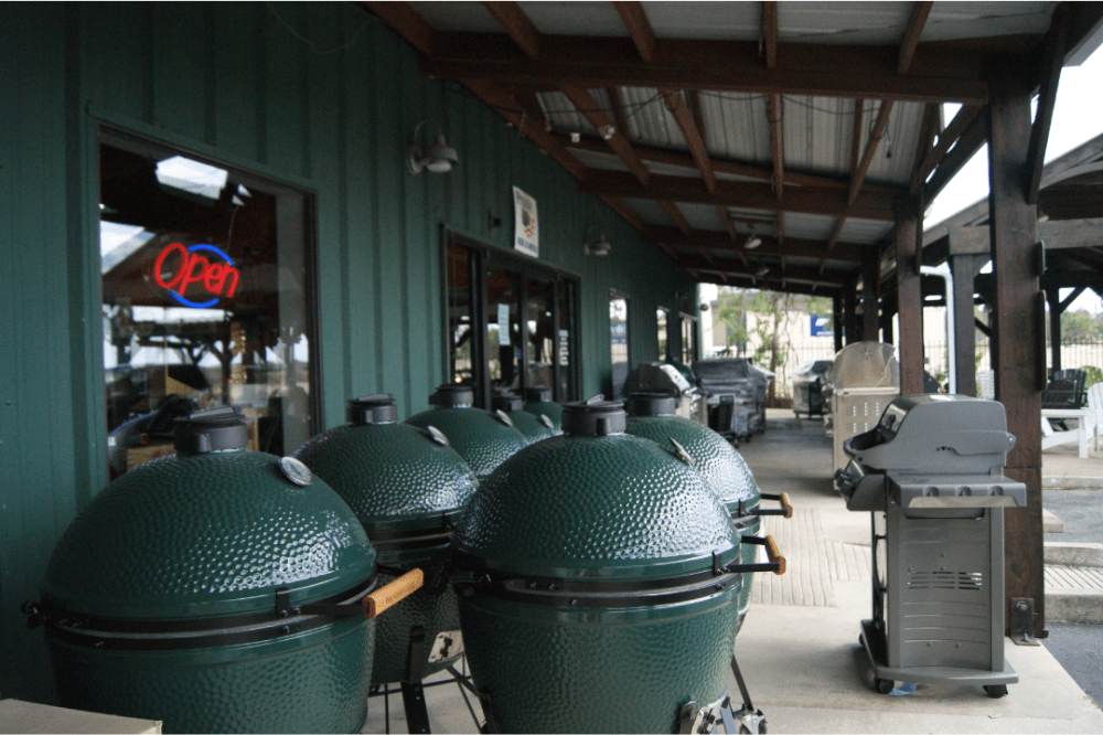 Image of the front exterior of the store with Big Green Egg grills outside. 