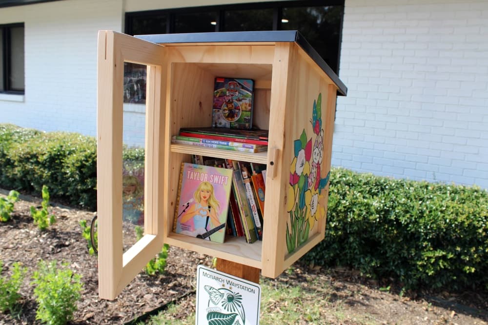 Little library with books inside. 