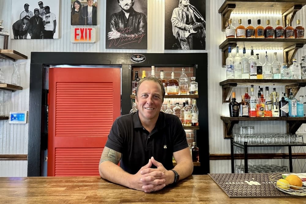Image shows Ross Wilkinson in his restaurant.