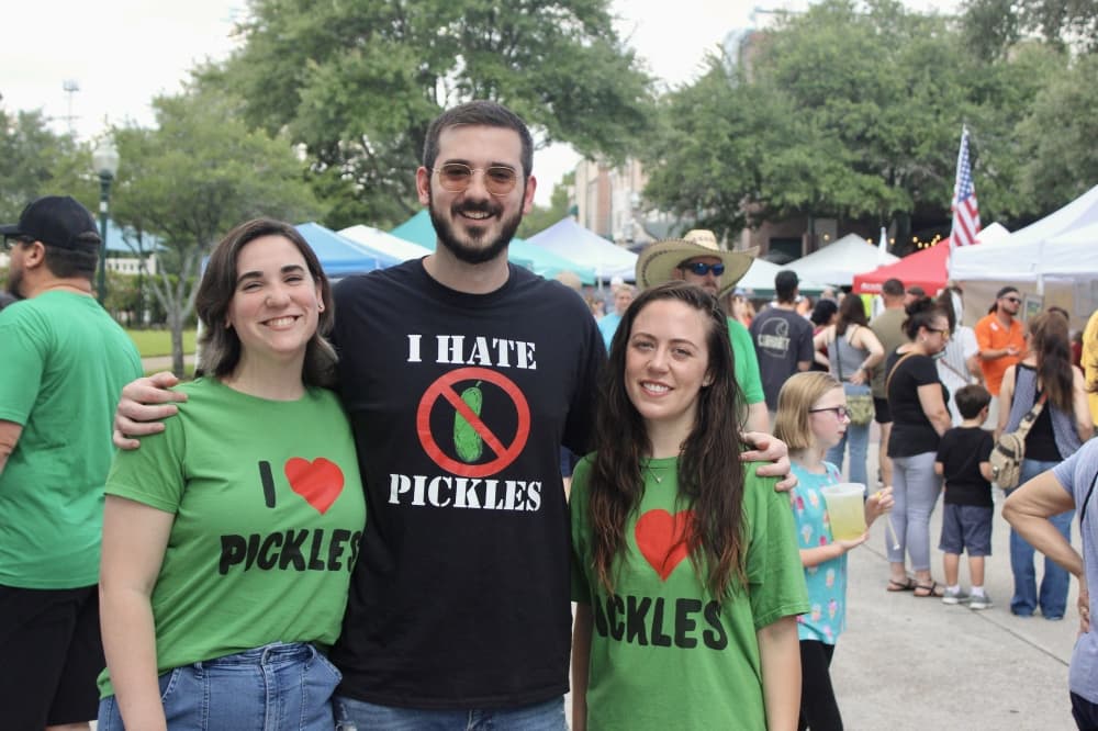 Attendees wearing pickle festival t-shirts