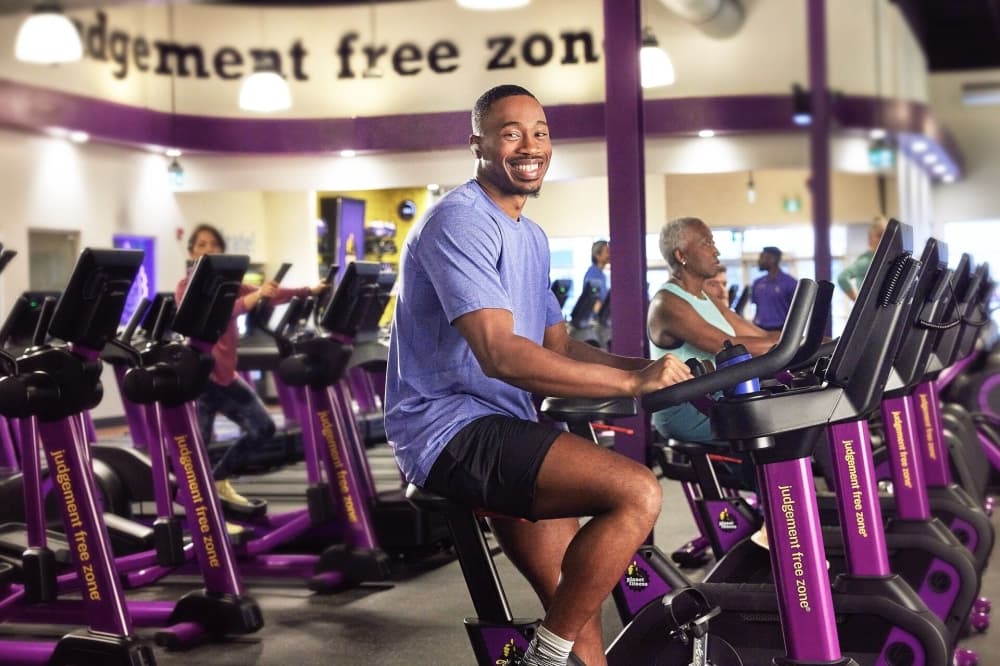 people riding stationary bikes