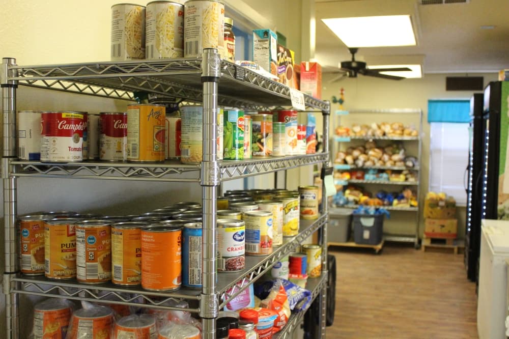 Cans sitting on a shelf
