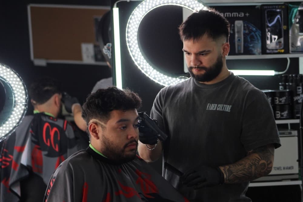 Christian Caballero cutting hair
