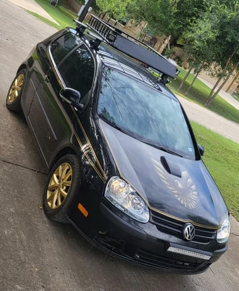 The black and gold vehicle is shown.