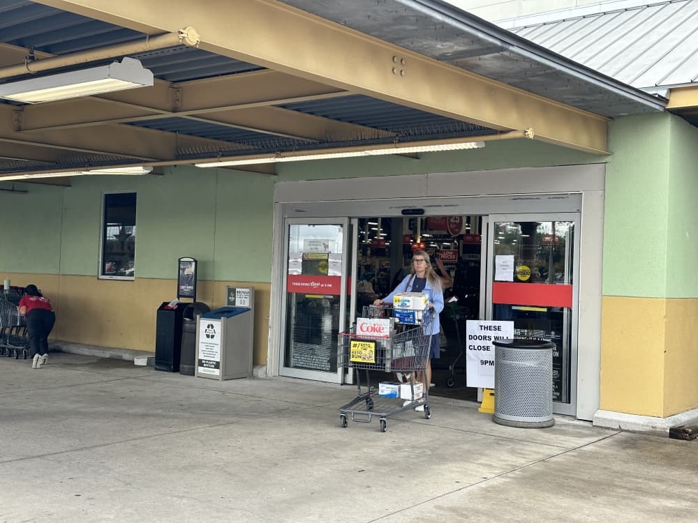 The new, temporary entrance is shown as a customer walks out of the doors.