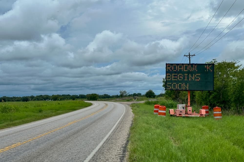 Road work begins soon sign