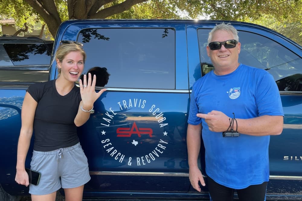 Weiss said he has been able to recover three wedding rings in the past month. Here he is shown returning a ring to its owner. (Courtesy Lake Travis Scuba)
