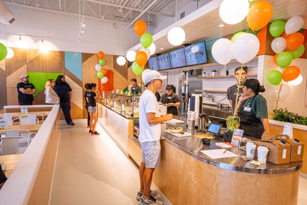 Chi’Lantro BBQ officials celebrate grand opening of Vintage Park restaurant