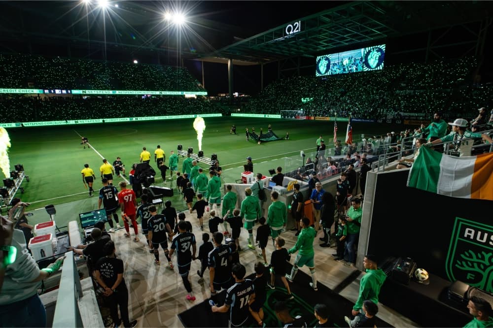 An image of the Austin FC running out on to the field. 