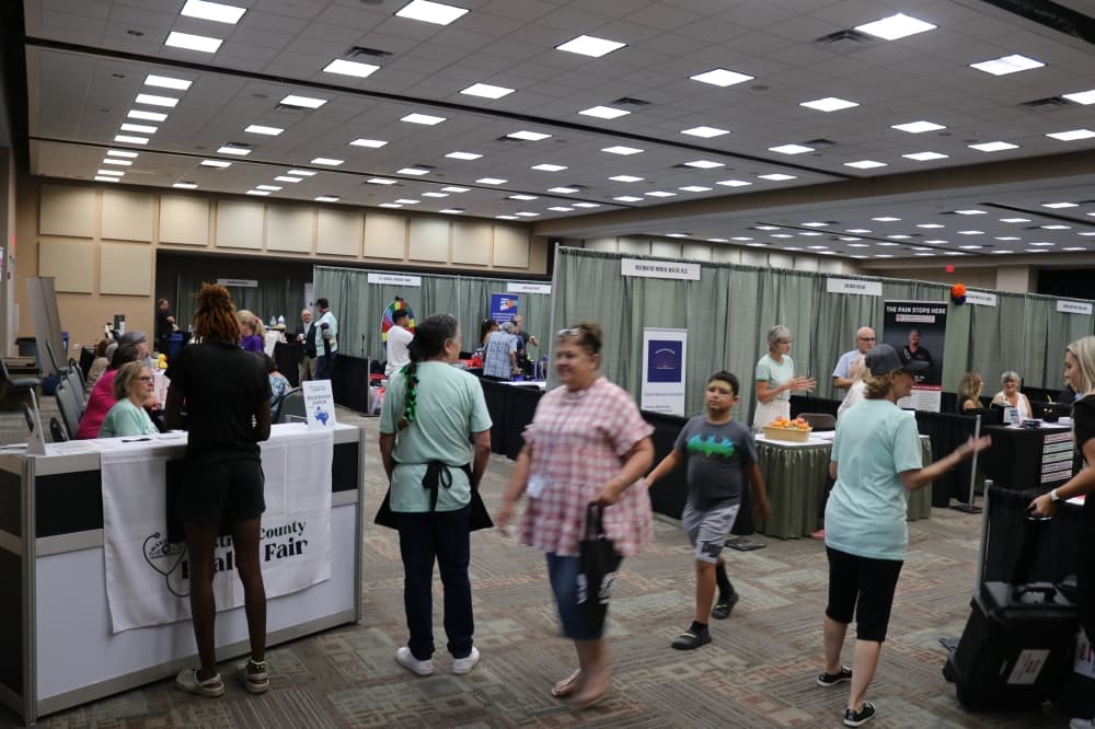 Vendors and attendees are shown in a wide shot.