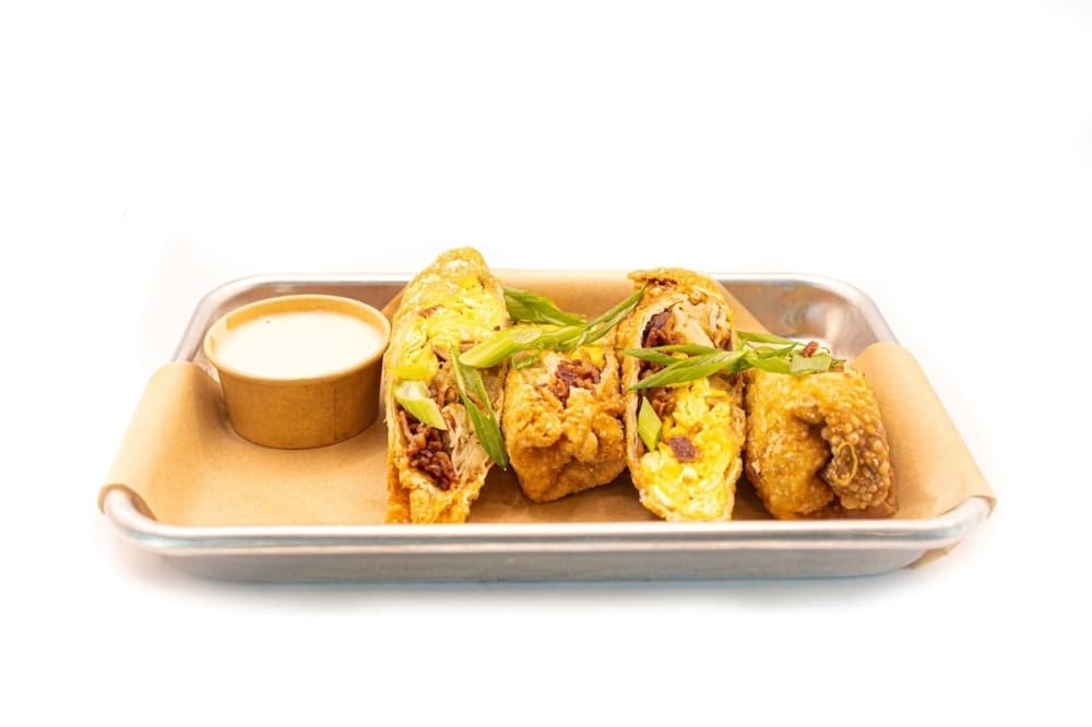 Photo shows egg rolls.