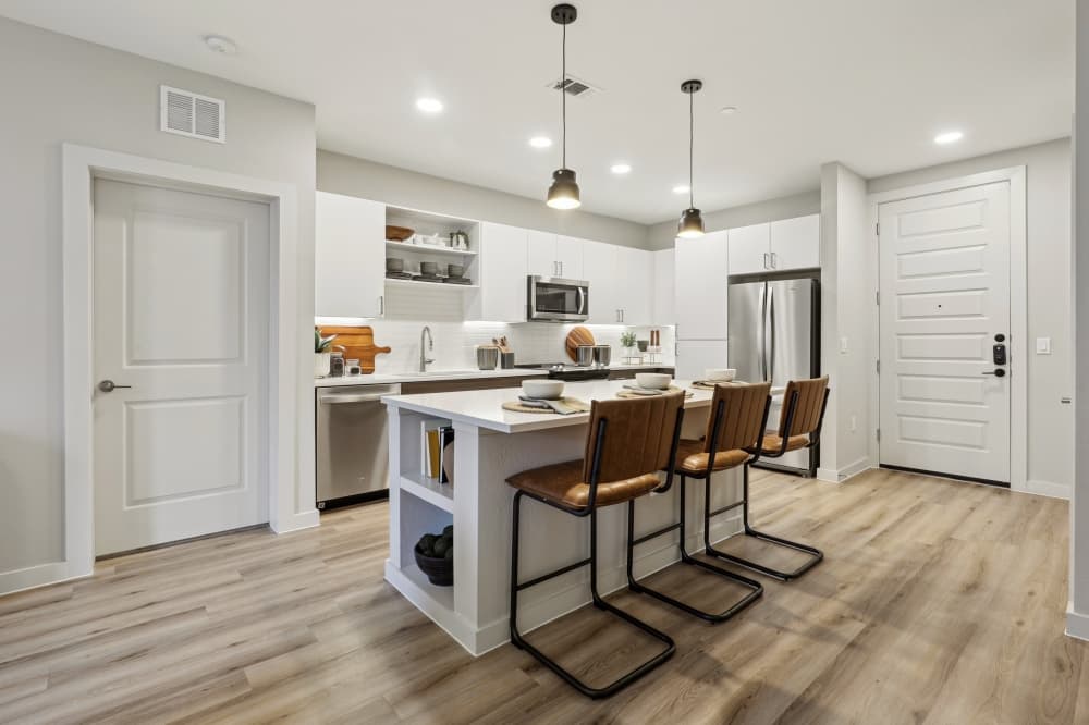 Image of a kitchen island within an apartment at Remy.