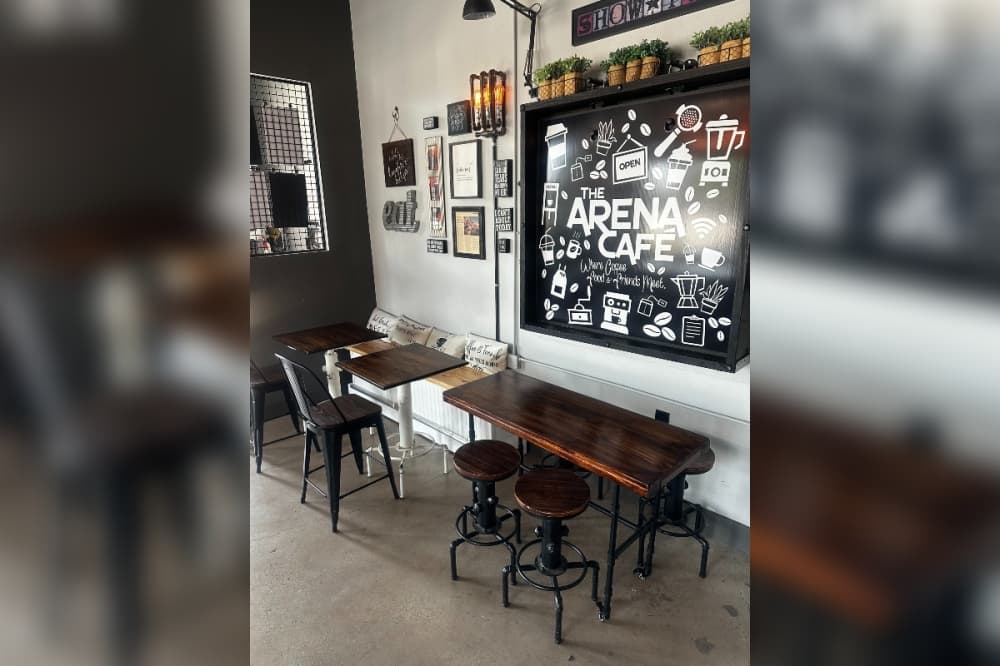 The Arena Cafe tables and sign
