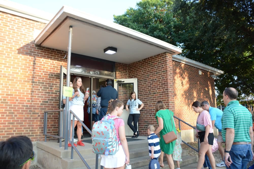 Several families walked from nearby neighborhoods to join their students on the first day at Lake Highlands Elementary School Aug. 13.