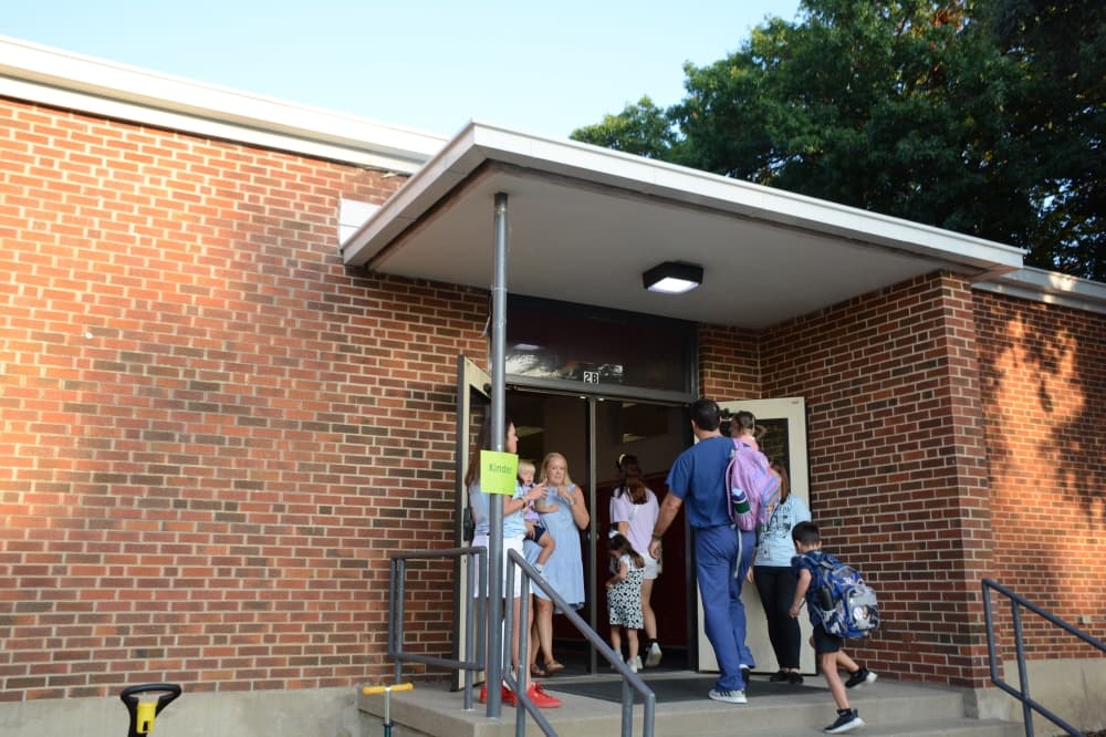 Students and their parents walk into Lake Highlands Elementary School during the first day Aug. 13.
