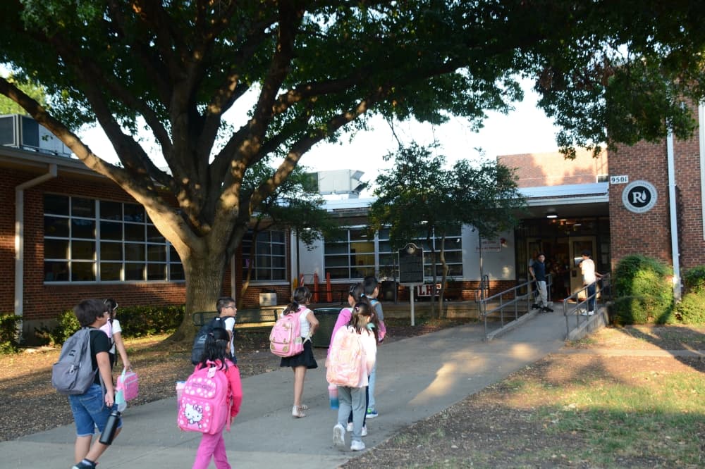 Students walk into one of the entrances at Lake Highlands Elementary School on the first day Aug. 13.