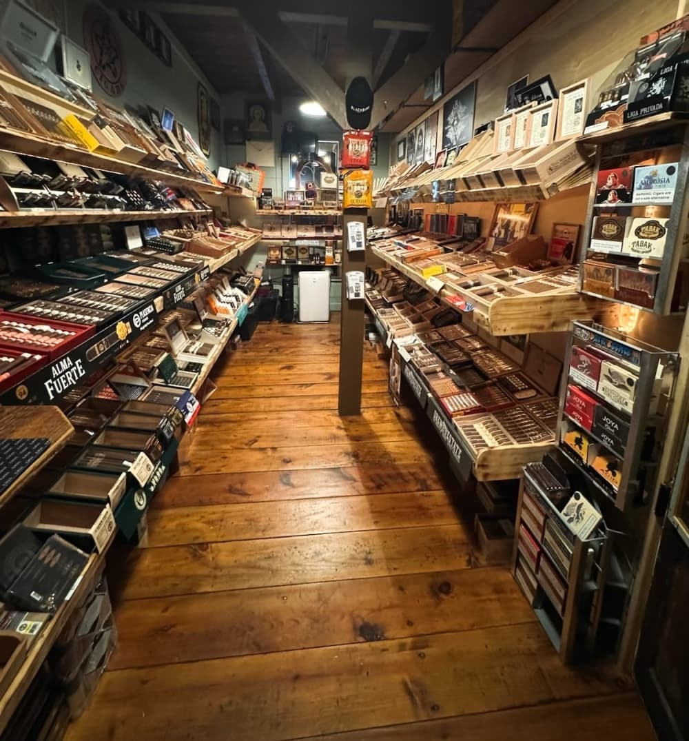 A photo shows the inside of the long, narrow walk-in humidor.