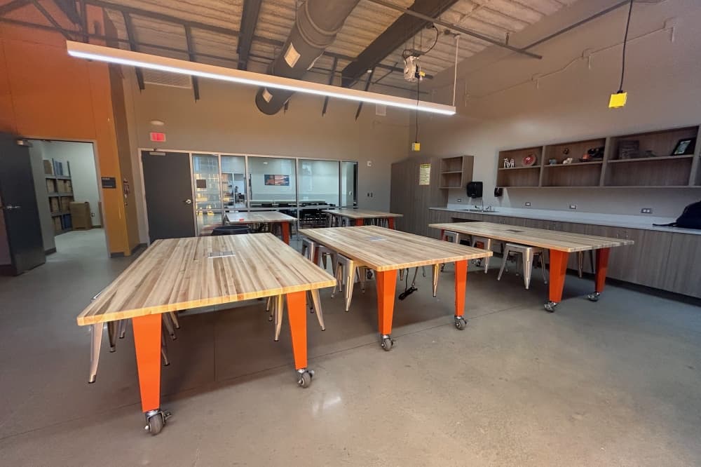 Gus Almquist was constructed with dedicated space for its robotics program. The classroom opens up to the central courtyard using garage-style doors, giving students more room to practice using their creations. (Brooke Sjoberg/Community Impact)