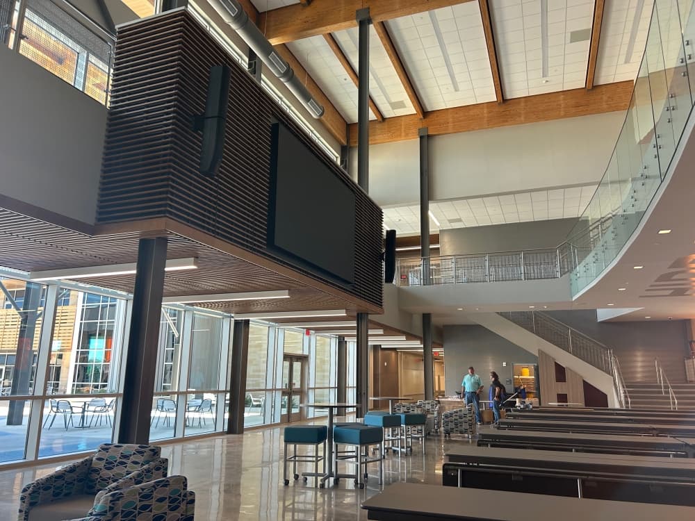In the cafeteria is a screen that will provide dual purpose for both the campus's esports program and teacher use, with a mezzanine for additional viewing space. (Brooke Sjoberg/Community Impact)