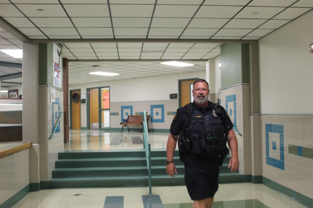 School Resource Officer Trey Toney walks Heritage Elementary School’s hallways on Aug. 14 while class is in session.