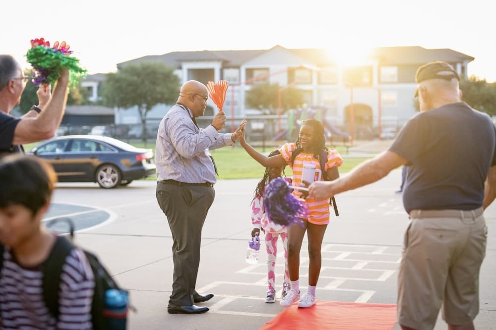 District staff greet students at Rockbrook Elementary as they walked through the doors Aug. 13. (Courtesy Lewisville ISD)