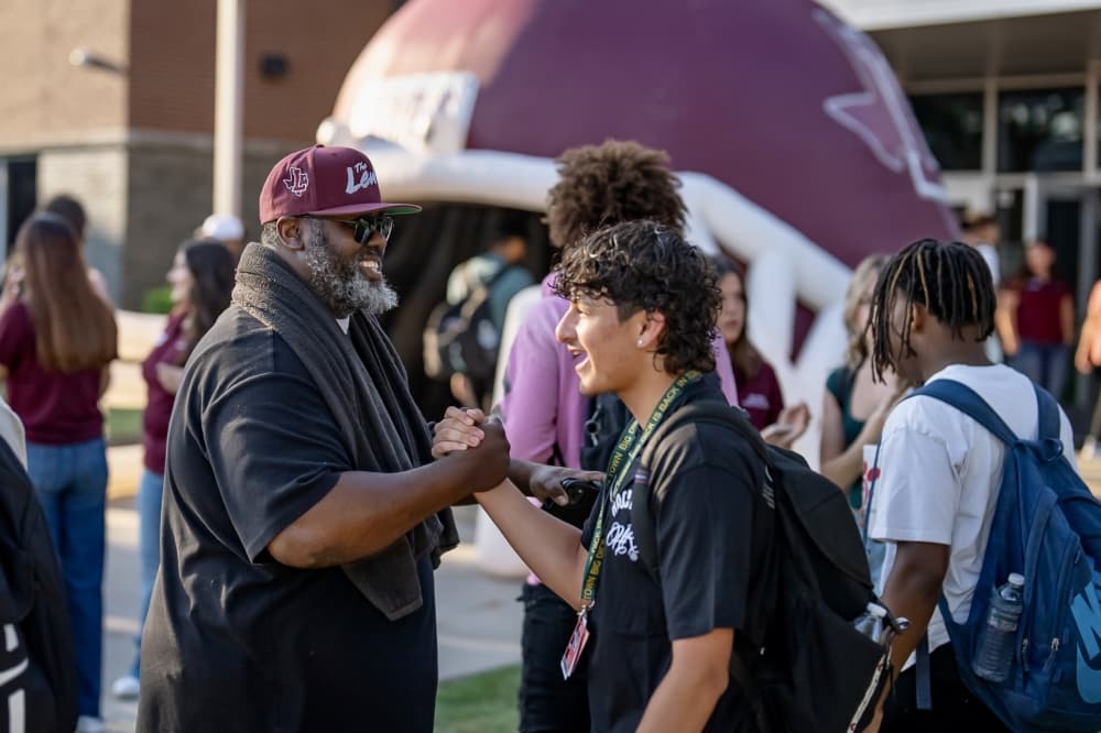 Students greet district staff at Lewisville High School on their first day back for the 2024-25 school year. (Courtesy Lewisville ISD) 