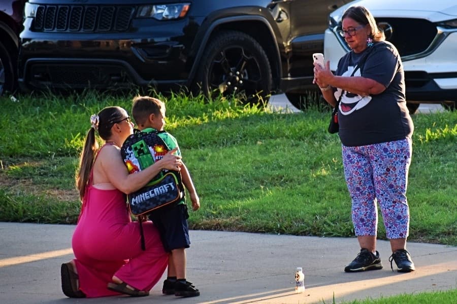 photo being taken of child and mother