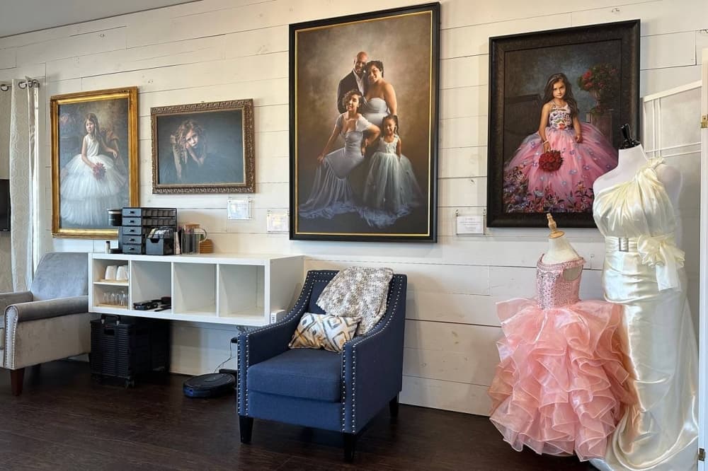 Photography studio with framed photos hanging on a wall. 