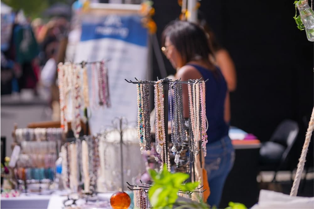 An image of some jewelry being sold at a vendor booth. 