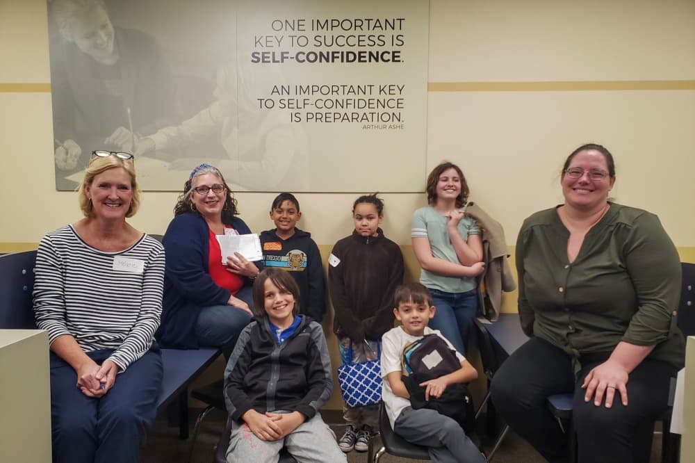 A photo of students at teachers at the center. 