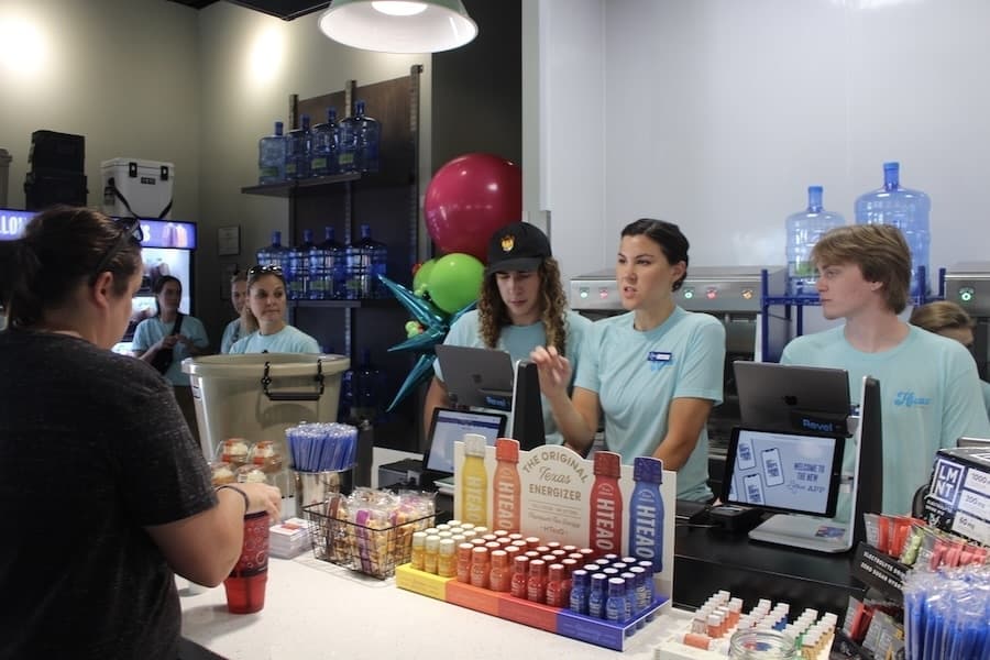 Picture of a store employee interacting with a customer.