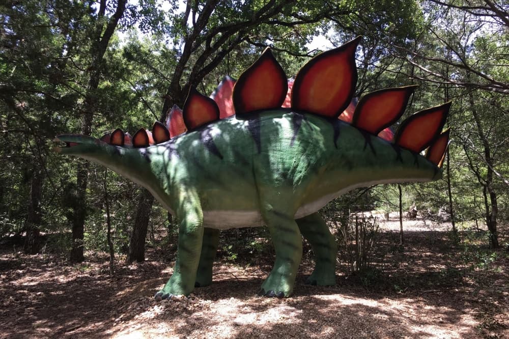 An image of one of the dinosaur sculptures at the park. 